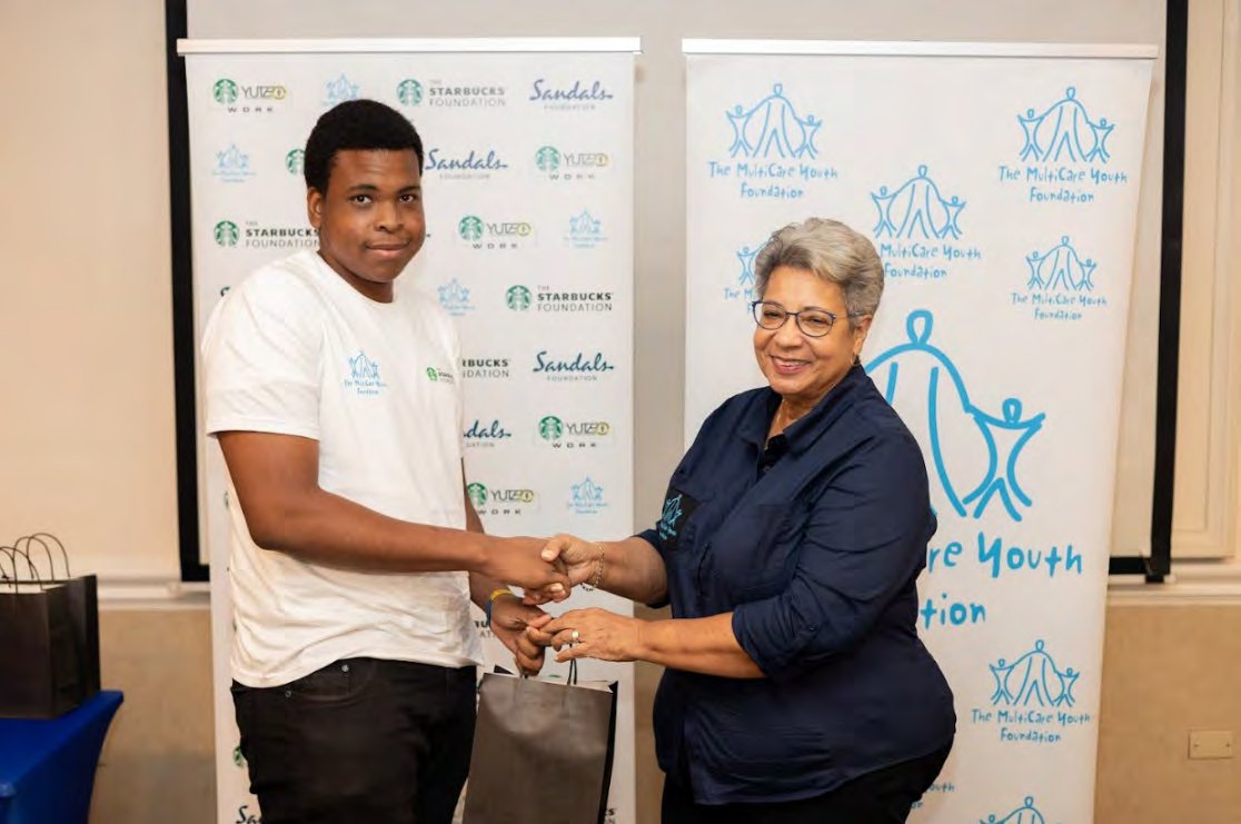 Salva Darwood receives a special award from Ann Astwood